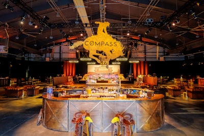 The venue’s arena was transformed into the Compass Saloon with a number of custom-branded elements throughout, including a 10-foot branded cowboy centerpiece over the main bar, along with custom fabricated saddle stools.