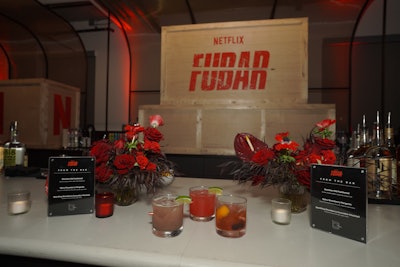 Inside, Analog Events styled the theater and party spaces with scenic builds, props, and branded details inspired by the show’s tone and themes. Custom glasses with real bullets (pictured) doubled as take-home gifts.