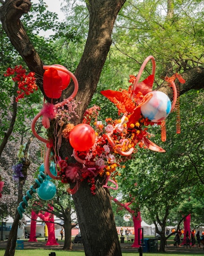 Trees throughout the festival grounds were decorated in a mix of balloons, florals, and Slinkies.