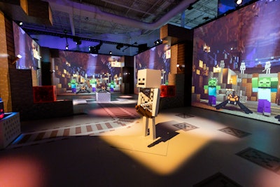 The experience lets visitors journey through seven Minecraft realms in an effort to help rescue the village, which is under siege from a zombie attack.