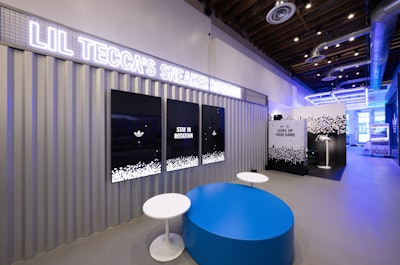 Production elements included a custom sneaker wall lit by 20 Astera Ax1 LED tubes, a bespoke Style Bar with integrated DJ booth and rotating shoe displays, and a custom overhead grid with 36 additional Astera lights to enhance the arcade vibe. A custom claw machine with holographic printed prizes and a three-screen video wall added to the high-energy atmosphere.