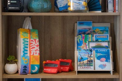 Designed as a lived-in creative studio, the activation featured vintage ads from top French brands, analog devices like viewfinders and Polaroid cameras, and a vinyl record player playing old school tunes inviting guests to recharge, reflect, and connect through the tactile spirit of classic ad culture.