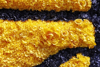 Among fresh daffodils, roses, carnations, lilies, and ivy was Indiana's state flower, the peony.
