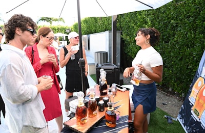 An Integrative Peptides Wellness Lounge, hosted by Dr. Kent Holtorf, offered a range of wellness treatments including health coaching, red light therapy, and peptide-based therapies. There was also a DJ set by William Reed and mini skincare treatments from Man Labs and celebrity estheticians. Guests could also enjoy gourmet offerings from Detroit’s Sly Fox Pizzaiolo and Anita’s Kitchen Co., sip Waiakea water and BLOWFISH Tequila, pose for portraits with celebrity photographer David Christopher Lee, and receive spiritual readings from psychic medium Lynn Darmon.