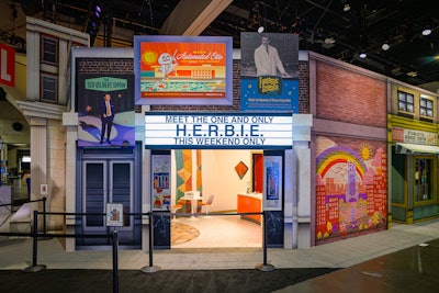 The multi-zone footprint offered quiet, immersive areas like Stanley’s Service Center and Timely Comics, where attendees could recharge from the sensory overload of the show floor while still staying inside the Marvel universe. Fans could also enjoy a photo op with a puppeteered H.E.R.B.I.E., the robot sidekick from the new film.
