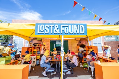 Attendees could ride a Ferris wheel with waterfront views, and browse the school's “Lost and Found” for show-themed giveaways. Signs of Our Lives coordinated local artists, who customized bucket hats and belt bags on site.