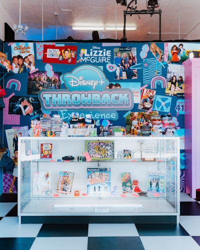 Fans were welcomed with this thrift shop-inspired entryway. The Walt Disney Archives provided memorabilia from some of the shows and movies to have on display throughout the experience. 'This was such a fun surprise and delight for the fans to see some of their favorite pieces up close,' Coan says.