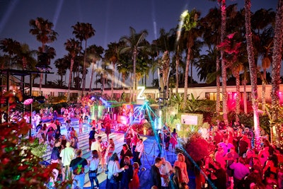 After the screening, guests headed to the Roosevelt Hollywood for a Camp Rayburn–themed after-party inspired by the film. The venue’s pool was topped with a plexiglass cover and branded graphics to create a glowing dance floor, surrounded by pennant flags, props, and faction-specific decor. A counselor’s cabin-style DJ booth sat beneath an illuminated “Z,” with laser lighting adding to the atmosphere. Interactive elements included character-inspired makeover stations, a slime activation from Sloomoo Institute, a 360-degree photo booth, and a display of the film’s costumes. Guests departed with gift bags featuring products from Ella+Mila and Sloomoo Institute.