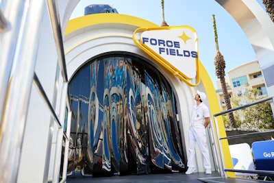 Each stop along the conveyor belt let fans immerse themselves in the world of The Fantastic Four: First Steps, including a Human Torch–themed photo op and interactive challenges inspired by characters like Mister Fantastic and The Thing.