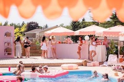 The evening unfolded with a pink gingham family-style dinner, a sunset beach walk, and a surprise hoedown. There were also breakfast basket deliveries and a Bloom Bar farewell.