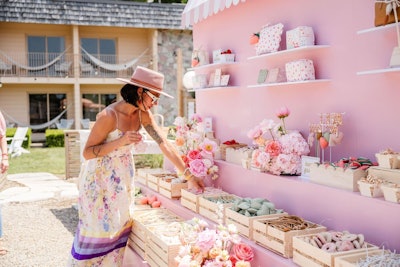 Guests were greeted with custom touchpoints at every turn, including branded luggage carts, a strawberry-wrapped VW van, and a playful U-Pick Charm Bar activation.