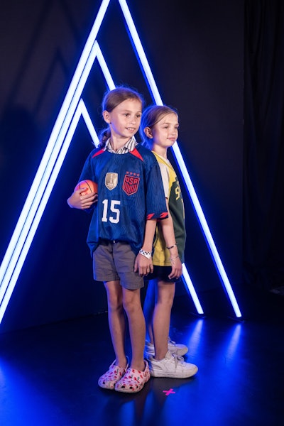 At a media day-inspired photo setup, guests could create their own player trading cards.
