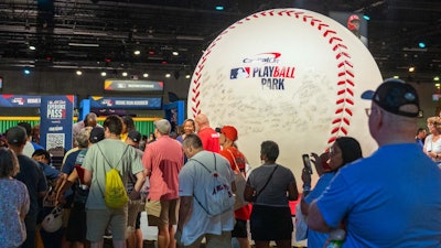 Fans could pose in front of a giant baseball that was signed by players like Willie Mays, Hank Aaron, Derek Jeter, Yogi Berra, and more.